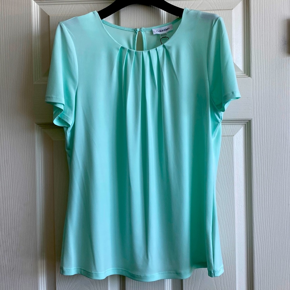 FREE Shipping!! Light teal CK blouse. Stunning against grey slacks!